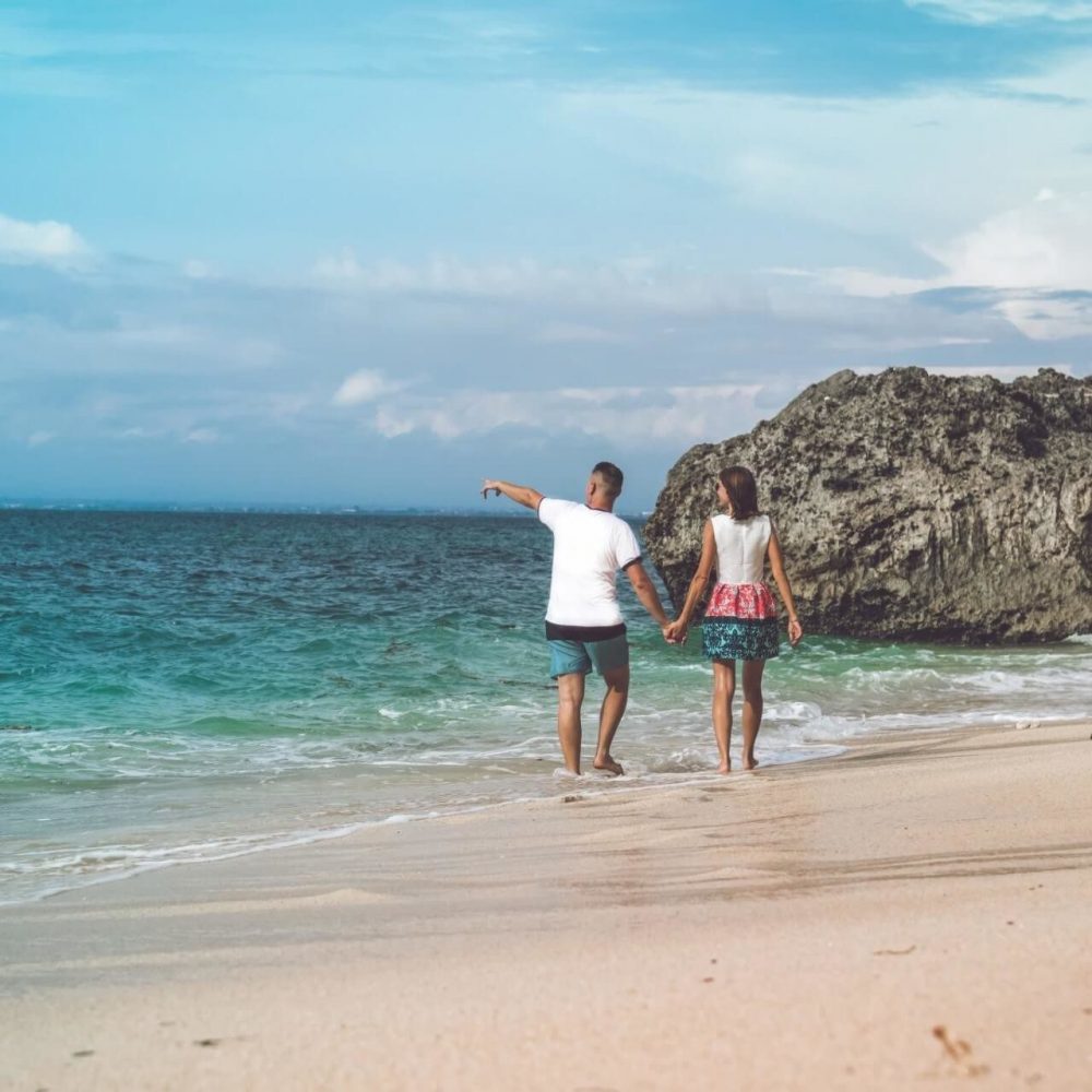 Things to do in Paphos - Happy couple stroll on the beach